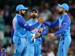 India's Rohit Sharma, left, and Virat Kohli shake hands. Dinesh Karthik in middle(AP) India's Rohit Sharma, left, and Virat Kohli shake hands. Dinesh Karthik in middle(AP)