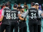 New Zealand's captain Kane Williamson (C) celebrates with teammates after victory during the T20 World Cup match between New Zealand and Sri Lanka