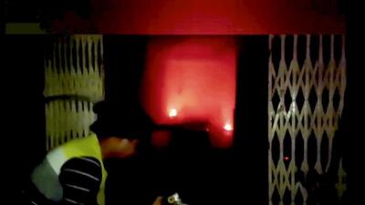 A video grab of a firefighter attempting to douse the fire that broke out at a house in Bihar's Aurangabad district on Saturday. (PTI) A video grab of a firefighter attempting to douse the fire that broke out at a house in Bihar's Aurangabad district on Saturday. (PTI)