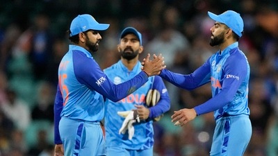 India's Rohit Sharma, left, and Virat Kohli shake hands. Dinesh Karthik in middle (AP) India's Rohit Sharma, left, and Virat Kohli shake hands. Dinesh Karthik in middle (AP)