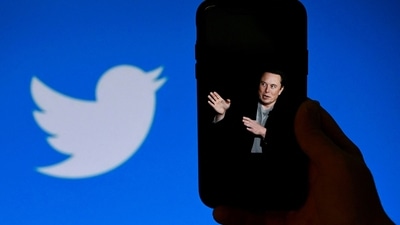 Elon Musk Twitter Takeover: A phone screen displays a photo of Elon Musk with the Twitter logo. (AFP) Elon Musk Twitter Takeover: A phone screen displays a photo of Elon Musk with the Twitter logo. (AFP)