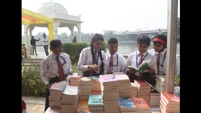 School children visiting book stalls after the inauguration of Gomti Book Festival at the Gomti Riverfront in Lucknow, on Saturday. (HT Photo)