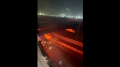 A screen grab of the viral video shows the IndiGo Delhi-Bengaluru flight's one engine caught fire at the time of taxiing at the airport in New Delhi on Friday. (ANI)