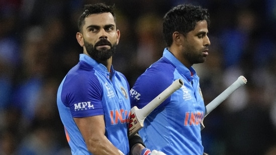 India's Virat Kohli, left, and teammate Suryakumar Yadav walk from the field at the end of their innings(AP)