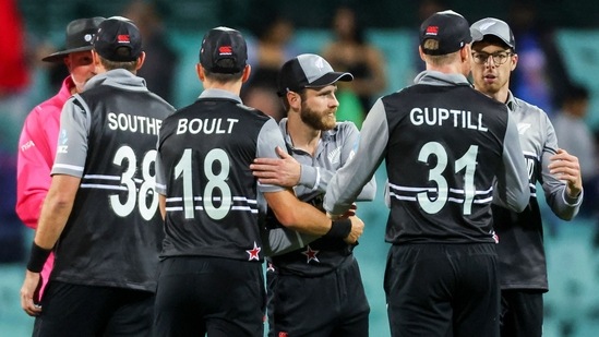 New Zealand's captain Kane Williamson (C) celebrates with teammates after victory during the T20 World Cup match between New Zealand and Sri Lanka