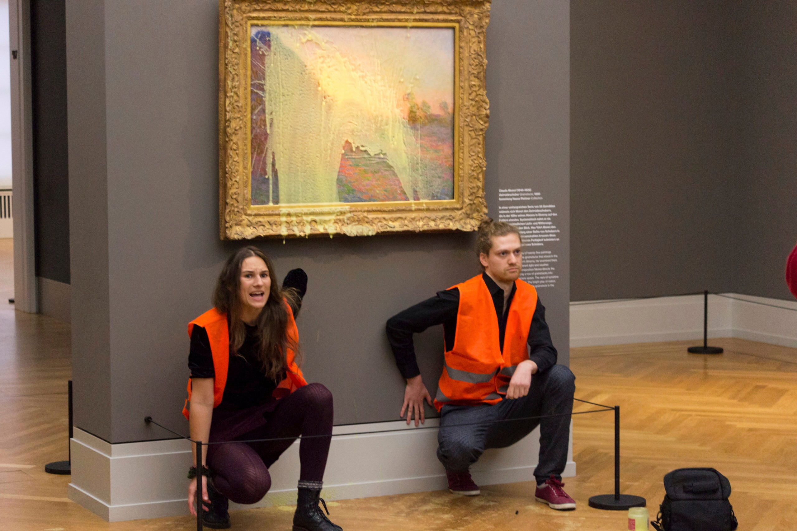 Climate protesters of Last Generation after throwing mashed potatoes at the Claude Monet painting "Les Meules” at Potsdam’s Barberini Museum (AP)