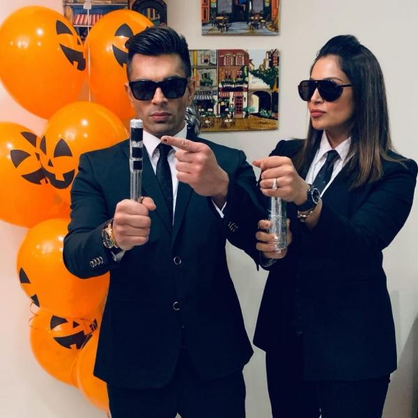 Getting dressed up as agent M and agent J from Men in Black for Halloween is another amazing couple outfit inspiration.(Instagram/@bipashabasu)