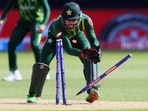 Mohammad Rizwan breaks the stumps in a run-out attempt during the ICC T20 World Cup 2022 match between Pakistan and Netherlands at the Perth Stadium(AFP)