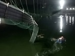 A view shows a damaged part of a suspension bridge after it collapsed in Morbi town in Gujarat. 