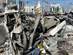 Wreckages of vehicles are destroyed at the scene of an explosion along K5 street in Mogadishu, Somalia.