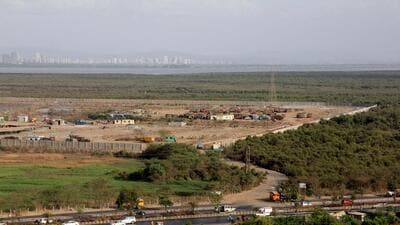 The establishment of a dumpsite in Kanjurmarg, on the banks of the Thane Creek, has long been criticised by environmentalists over possible damage to the area’s mangrove ecology. (Hindustan Times) The establishment of a dumpsite in Kanjurmarg, on the banks of the Thane Creek, has long been criticised by environmentalists over possible damage to the area’s mangrove ecology. (Hindustan Times)