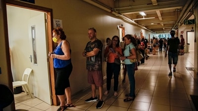 Brazil Elections: Voters wait in line to cast a ballot at a polling station. (Bloomberg)