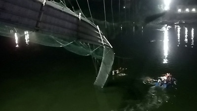 A view shows a damaged part of a suspension bridge after it collapsed in Morbi town in Gujarat. (REUTERS)