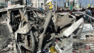 Wreckages of vehicles are destroyed at the scene of an explosion along K5 street in Mogadishu, Somalia. (Reuters)