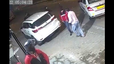 A video of the crime shows the car driver parks his white Fortuner car near the spot where three persons come on a motorcycle. When driver comes out of the vehicle, one of the bike riders take out a pistol from his pocket and threatens the driver. (Video grab)