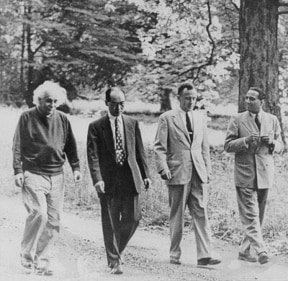 (L-R) Physicists Albert Einstein, Hideki Yukawa, John Wheeler, and Homi J. Bhabha in conversation as they walk through Marquand Park in Princeton, New Jersey (1954). (@PhysInHistory/ Twitter)
