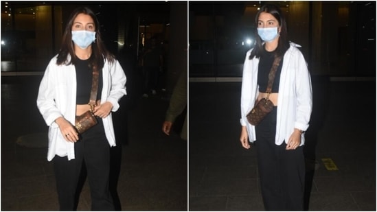 Anushka Sharma returns to Mumbai was dressed in checked pants by Zara, a  black tee and a Kate Spade bag…