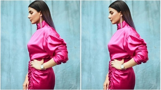 Kirti decked up in a pink long satin dress with turtle neck details and quarter sleeves. It also featured gathered up details below the waist and one thigh high slit. (Instagram/@iamkirtikulhari)