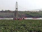 A rescue operation underway after a cable bridge collapsed in the Machchhu river, in Morbi on Monday. (ANI Photo) A rescue operation underway after a cable bridge collapsed in the Machchhu river, in Morbi on Monday. (ANI Photo)