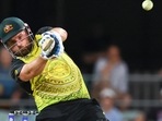 Aaron Finch hits a boundary during the T20 World Cup cricket match between Australia and Ireland, in Brisbane.