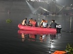 Rescuers on boats search in the Machchu river next to a cable bridge that collapsed in Morbi town of western state Gujarat. (AP) Rescuers on boats search in the Machchu river next to a cable bridge that collapsed in Morbi town of western state Gujarat. (AP)