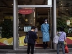 Covid In Macau A security guard controls the entrance to a bank in the Fai Chi Kei area. Covid In Macau A security guard controls the entrance to a bank in the Fai Chi Kei area.