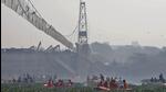 Rescuers search for survivors after a suspension bridge collapsed in Morbi town in Gujarat on Sunday. (REUTERS) Rescuers search for survivors after a suspension bridge collapsed in Morbi town in Gujarat on Sunday. (REUTERS)