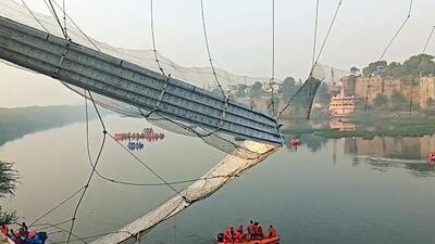National Disaster Response Force (NDRF) personnel conduct a rescue operation after a cable bridge collapsed in the Machchhu river in Morbi on Monday. (ANI) National Disaster Response Force (NDRF) personnel conduct a rescue operation after a cable bridge collapsed in the Machchhu river in Morbi on Monday. (ANI)