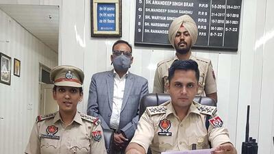Accused who posed as Interpol officer in the custody of Division number 2 police in Ludhiana. (HT PHOTO) Accused who posed as Interpol officer in the custody of Division number 2 police in Ludhiana. (HT PHOTO)