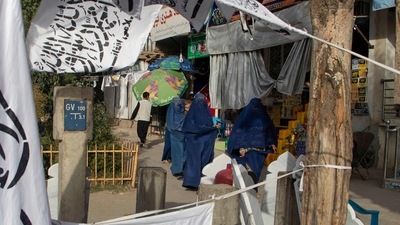 Afghan burqa-clad women walk amid a market. (AFP - Image for representation only) Afghan burqa-clad women walk amid a market. (AFP - Image for representation only)