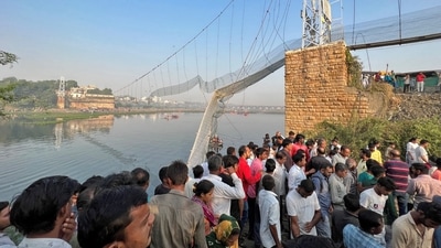 Visuals from the disaster site showed the bridge split in the middle and the metal carriageway hanging down, its metal cables snapped in places. (REUTERS)
