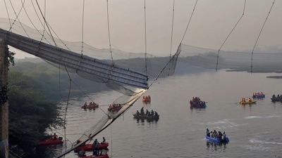 Rescuers search for survivors after a suspension bridge collapsed in Morbi town in the western state of Gujarat, India, (REUTERS)