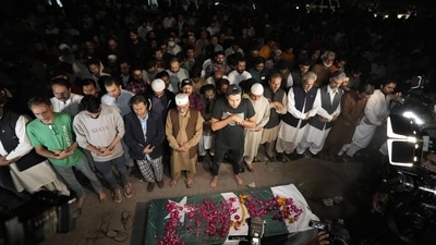 People pray during a funeral ceremony for a female journalist in Lahore, Pakistan. (AP) People pray during a funeral ceremony for a female journalist in Lahore, Pakistan. (AP)