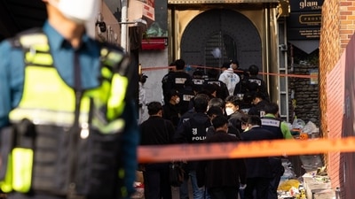 South Korea Stampede: Crime scene and forensic investigators at the site of a deadly crowd crush. (Bloomberg) South Korea Stampede: Crime scene and forensic investigators at the site of a deadly crowd crush. (Bloomberg)