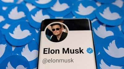Elon Musk's Twitter profile is seen on a smartphone placed on printed Twitter logos in this picture illustration taken April 28, 2022. REUTERS/Dado Ruvic/Illustration/File Photo (REUTERS)