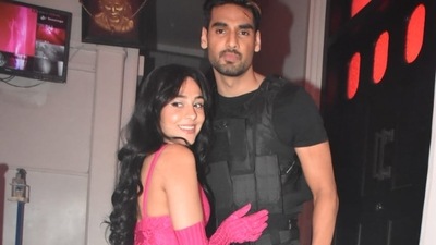 Ahan Shetty, who made his debut with Tadap, was seen in a black outfit paired with a bullet proof vest and a few guns. His friend was in a pink catsuit. (Varinder Chawla) 