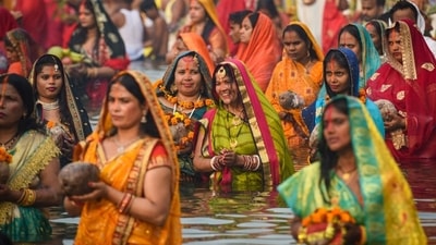Devotees are seen performing rituals inside an artificial pond created by the Delhi government for Chhath Puja in New Delhi. (HT Photo/Sanchit Khanna) Devotees are seen performing rituals inside an artificial pond created by the Delhi government for Chhath Puja in New Delhi. (HT Photo/Sanchit Khanna)