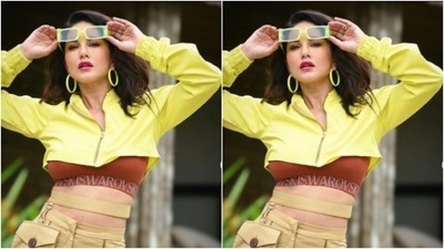 Sunny added more glam to her look with neon yellow hoop earrings and tinted shades with yellow frames. She accessorised her look with neon yellow stilettos as well. (Instagram/@sunnyleone) Sunny added more glam to her look with neon yellow hoop earrings and tinted shades with yellow frames. She accessorised her look with neon yellow stilettos as well. (Instagram/@sunnyleone)