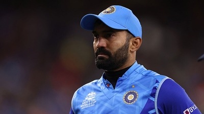 Dinesh Karthik walked off the ground clutching his lower back (Getty) Dinesh Karthik walked off the ground clutching his lower back (Getty)