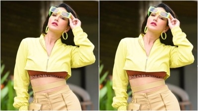 Sunny embraced summer in a maroon sports bra and layered it with a bright neon yellow cropped jacket. In ochre trousers with cut-out details at the ankles, Sunny completed her look. (Instagram/@sunnyleone) Sunny embraced summer in a maroon sports bra and layered it with a bright neon yellow cropped jacket. In ochre trousers with cut-out details at the ankles, Sunny completed her look. (Instagram/@sunnyleone)