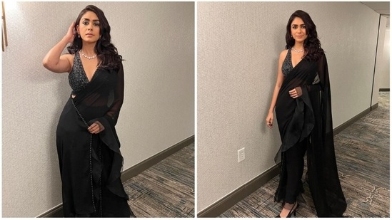 Mrunal Thakur has lately been in the limelight for not just her films but also her sartorial fashion choices. From street weat to traditional fits, the Jersey actor sure knows how to ace any look effortlessly. Recently, she treated her Instagram family of more than seven million followers with stunning images of herself in a black ruffled saree.(Instagram/@mrunalthakur)