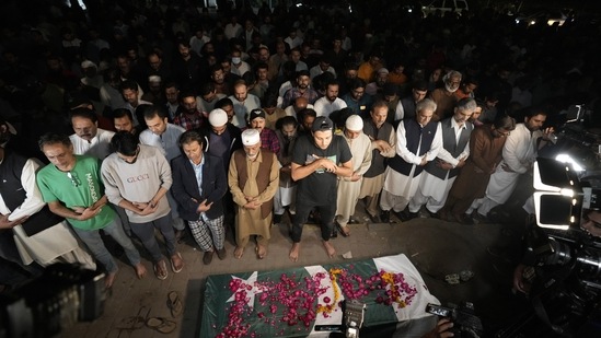 People pray during a funeral ceremony for a female journalist in Lahore, Pakistan. (AP)