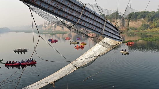 Rescue personnel conduct search operations after a bridge across the river Machchhu collapsed at Morbi in Gujarat. (AFP)