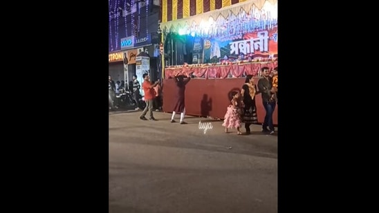The image, taken from a Facebook video, shows a woman dancing to Yaad Aa Raha Hai Tera Pyar outside a puja pandal in Kolkata(Facebook/Tania Maitra)
