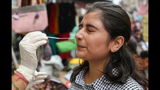 Jammu: A healthcare worker collects a swab sample of a woman for Covid-19 test, in Jammu, Tuesday, Aug. 16, 2022. (PTI Photo)(PTI08_16_2022_000110B) (PTI)