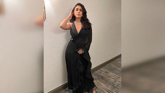 Mrunal Thakur paired her contemporary ruffled saree with a dazzling halter blouse. (Instagram/@mrunalthakur)