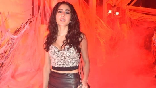 Sara Ali Khan attended friend Orhan Awatramani's Halloween bash in a studded silver top and brown short skirt paired with boots. She shared several pictures from the bash on her Instagram page. (Varinder Chawla)
