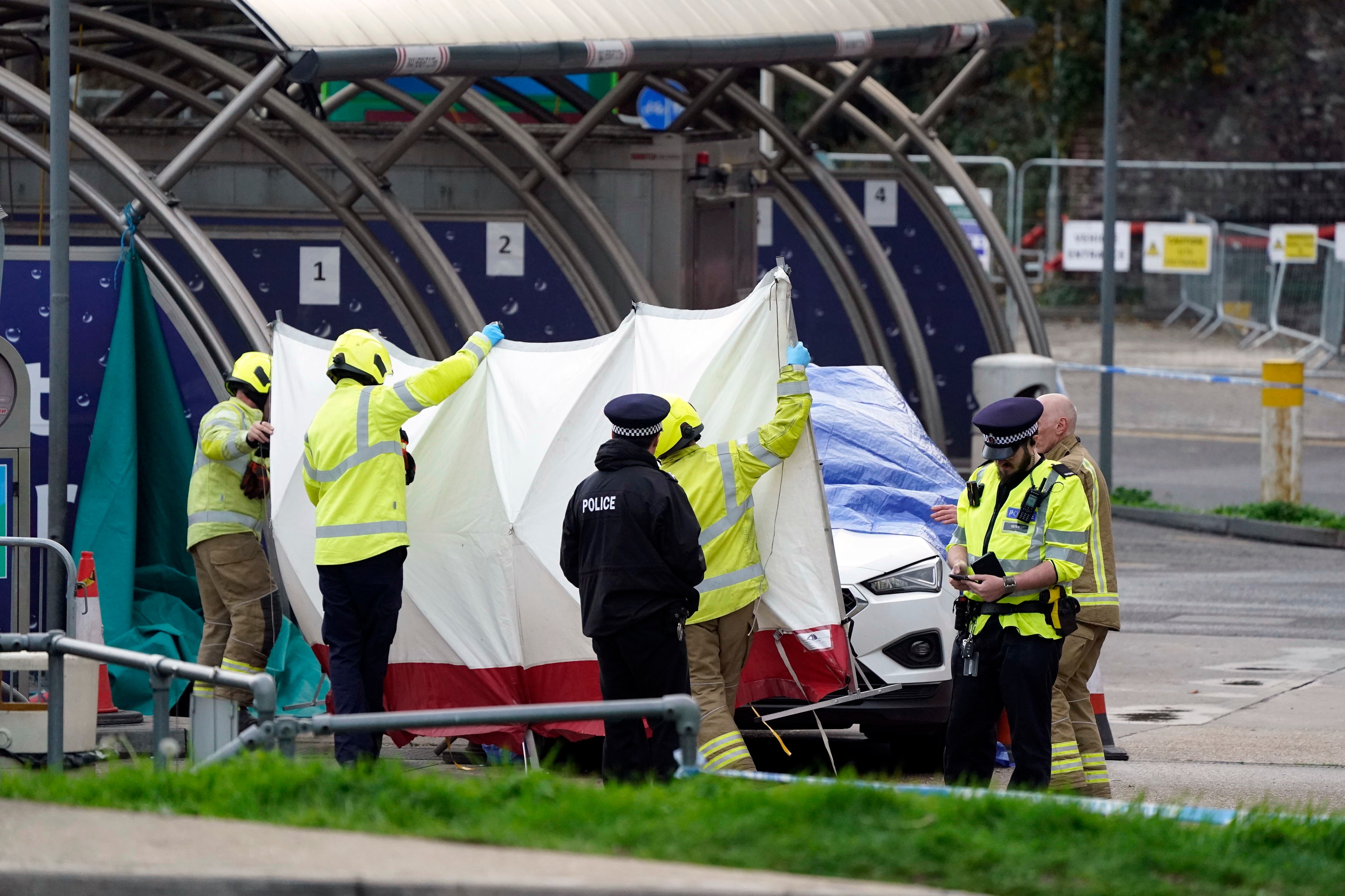 The emergency services erect a tent around the car allegedly involved in an incident near the migrant processing centre in Dover, England (AP) The emergency services erect a tent around the car allegedly involved in an incident near the migrant processing centre in Dover, England (AP)