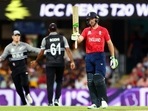 England's Jos Buttler raises his bat after completing fifty during the ICC Men's T20 World Cup 2022 match against New Zealand at The Gabba