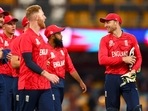 England's Captain Jos Buttler (R) shares the laugh with teammates after their win during the ICC men's Twenty20 World Cup 2022 cricket match between England and New Zealand